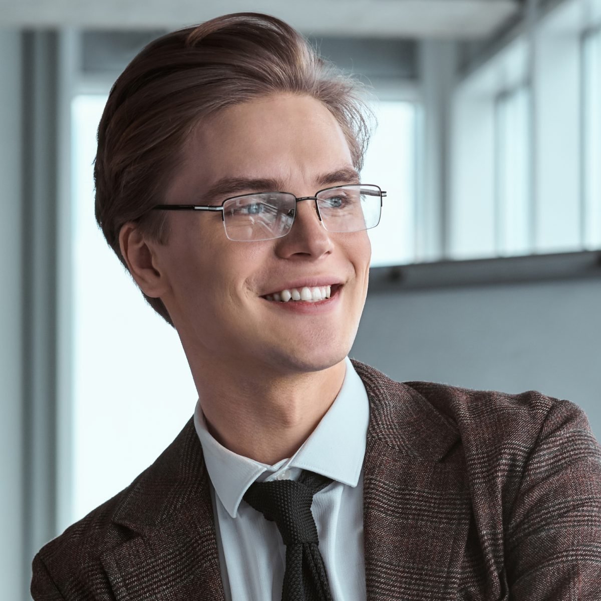 at-young-businessman-in-eyeglasses-at-office-sitting-2023-11-27-05-10-32-utc-1.jpg